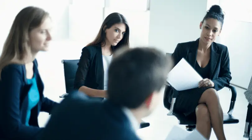 Group of business professionals at office meeting