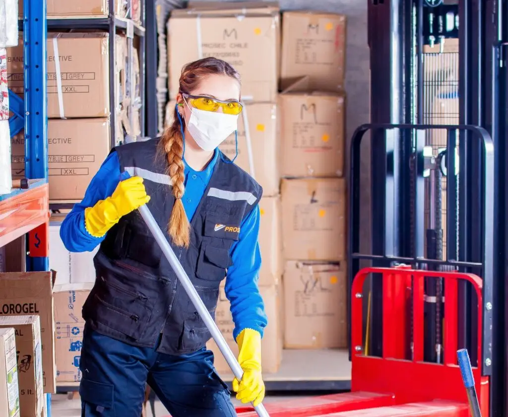 Non-native English speaking employee with safety goggles and mask